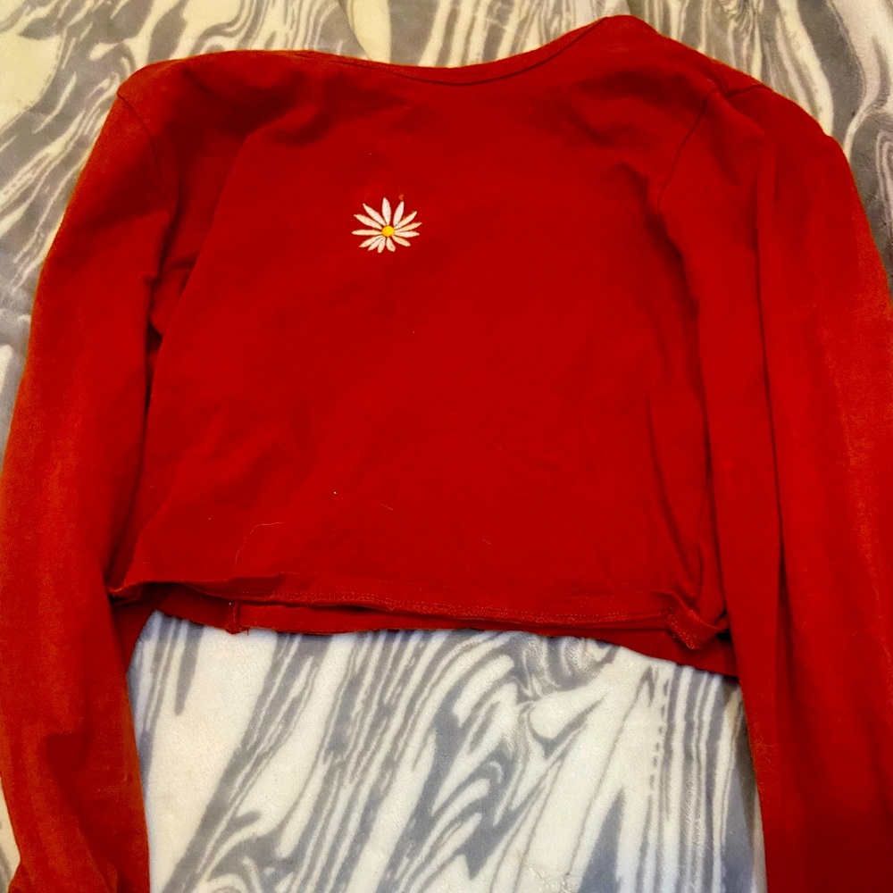 Hollister red cropped long sleeve with a daisy on the front